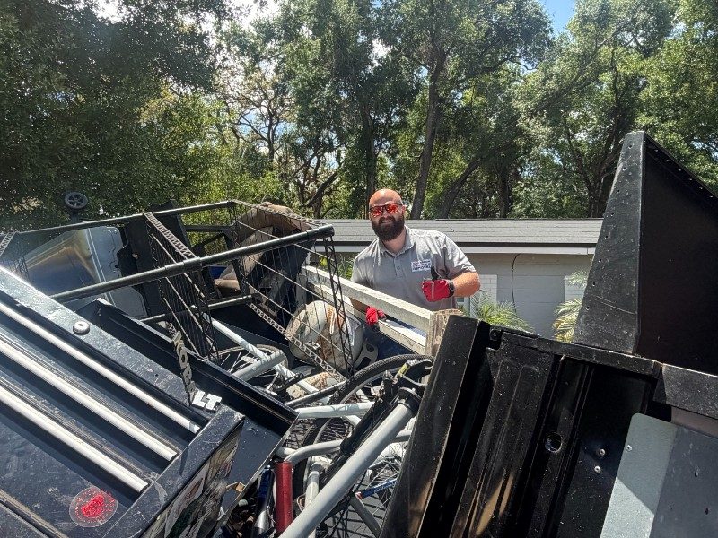 Junk Nation Removal trailer loaded with junk and debris cleared from a Tampa Bay property