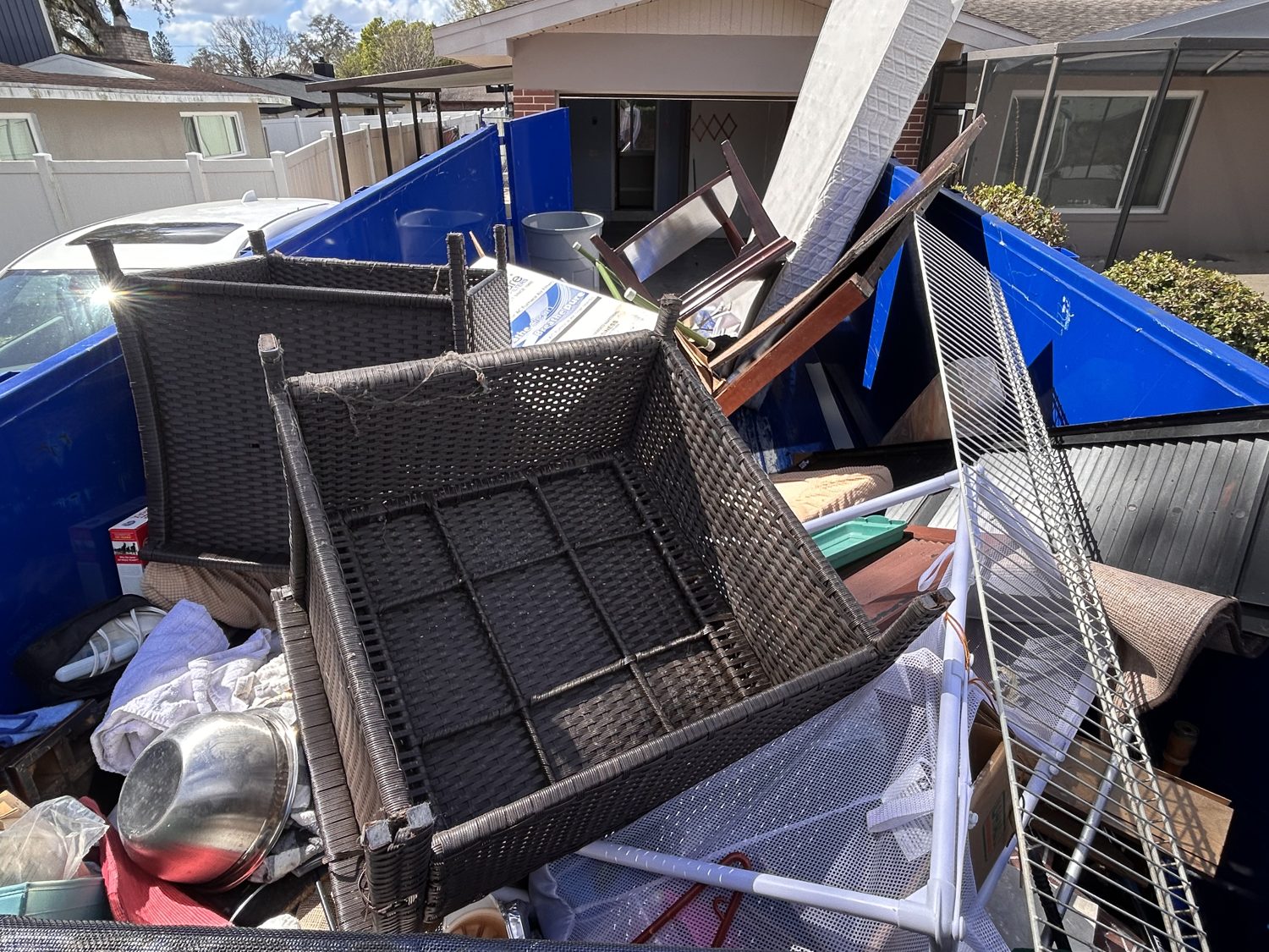 Junk Nation Removal trailer loaded during a foreclosure cleanout
