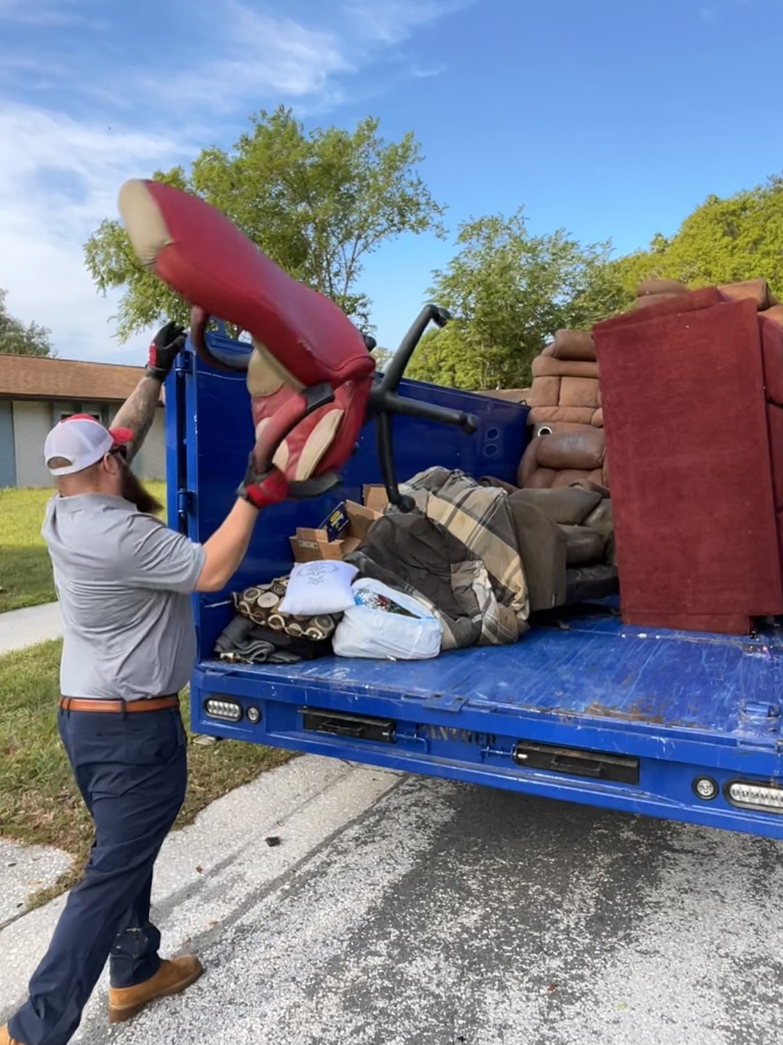 Junk Nation Removal crew loading furniture during a full home cleanout