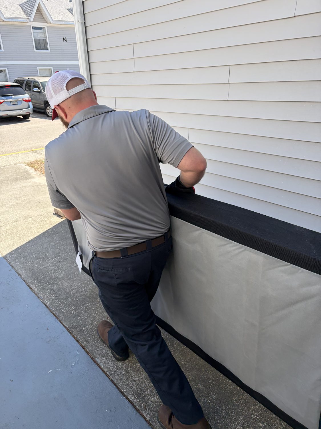 Junk Nation Removal team member removing a single bulky item