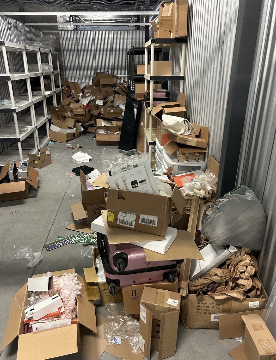 Packed storage unit being cleared by Junk Nation Removal